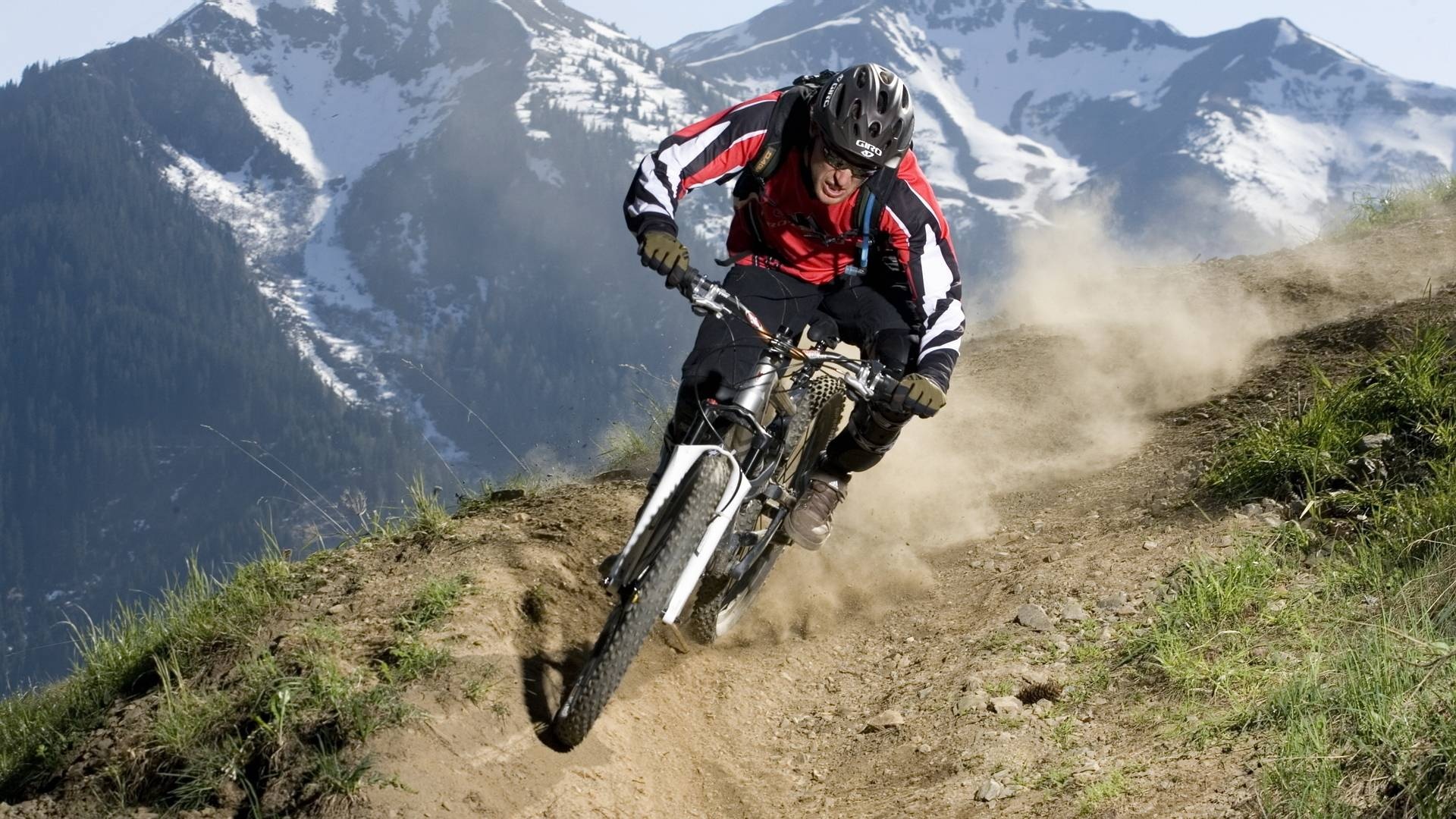 Downhill mountain biker, Dusty alpine trail, Snowcapped mountain peaks Downhill mountain biker, Dusty alpine trail, Snowcapped mountain peaks — 1920×1080 HD wallpaper