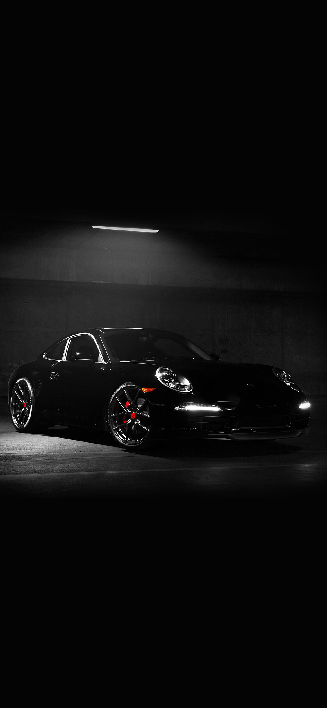 Porsche 911, All-black coupe, Dark garage light Porsche 911, All-black coupe, Dark garage light — 1125×2436 HD wallpaper