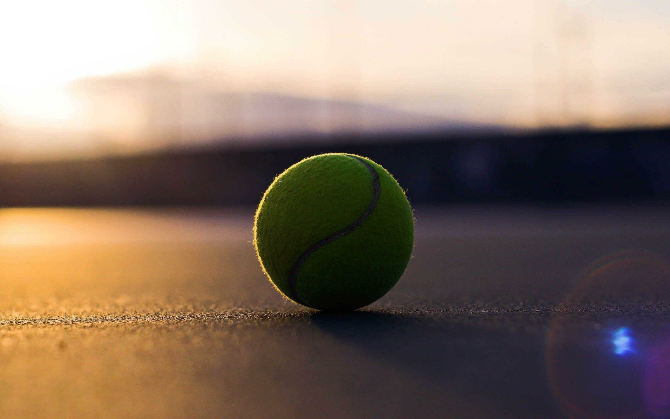 Yellow tennis ball, Empty tennis court, Sunset lens flare Yellow tennis ball, Empty tennis court, Sunset lens flare — 2560×1600 HD wallpaper