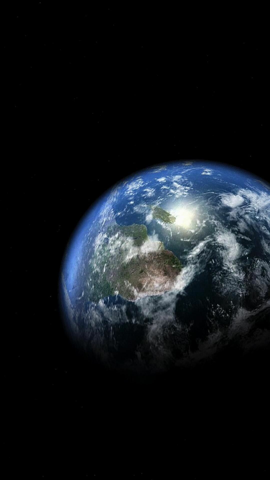 Planet Earth from space, Sunlight glare on continent, Black cosmic void Planet Earth from space, Sunlight glare on continent, Black cosmic void — 1080×1920 HD wallpaper