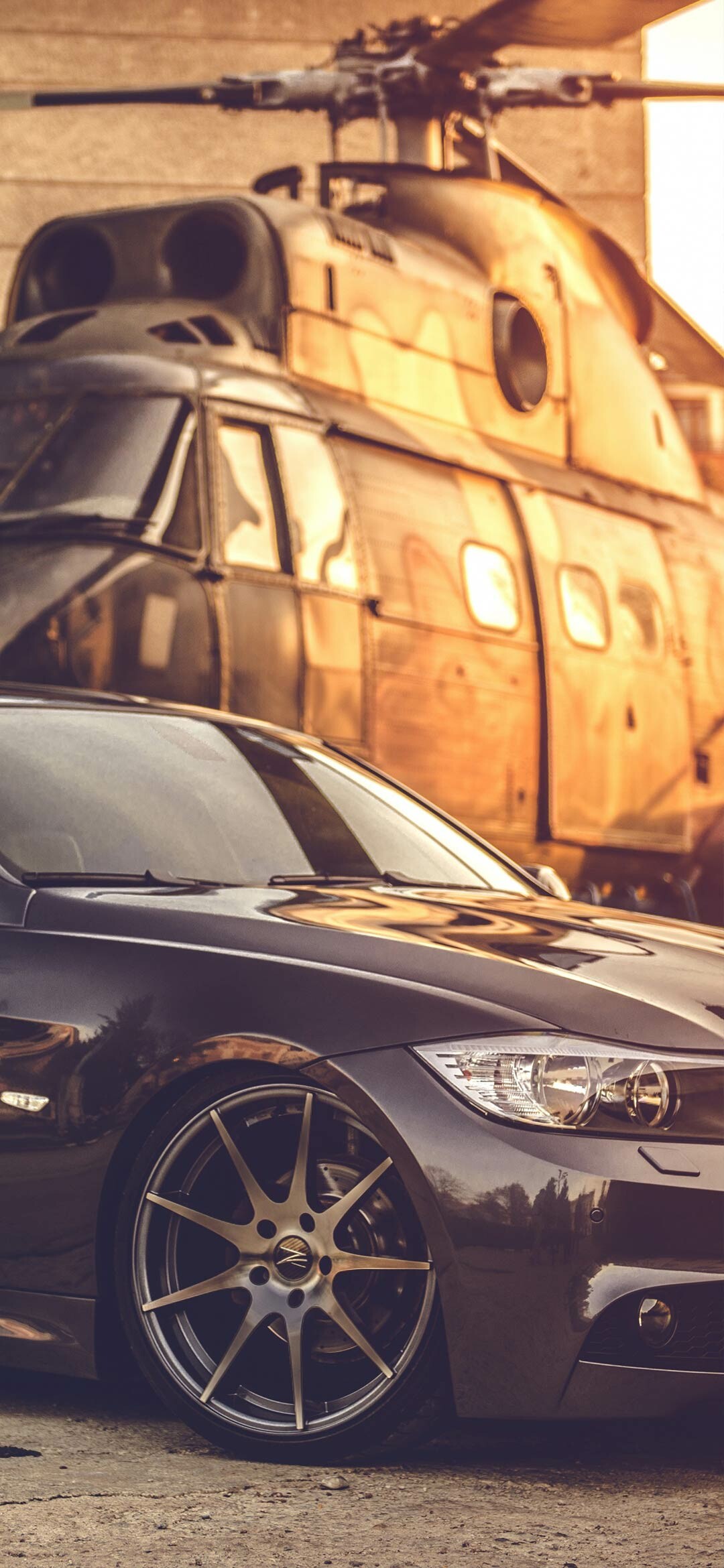 BMW 3 Series (E90), Graphite metallic paint, Military transport helicopter, Golden hour backdrop BMW 3 Series (E90), Graphite metallic paint, Military transport helicopter, Golden hour backdrop — 1080×2340 HD wallpaper