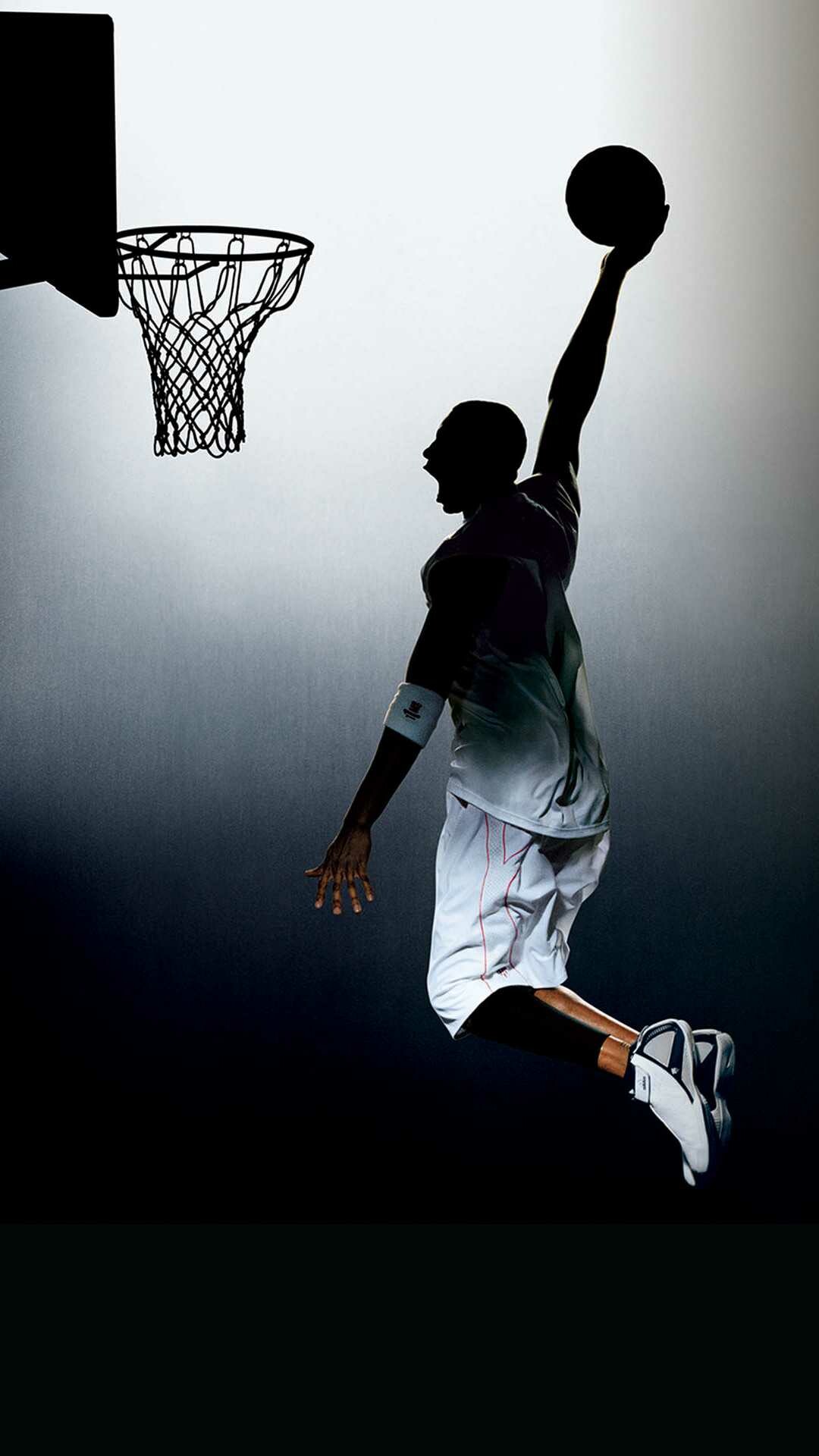 Silhouetted player mid-dunk, Basketball hoop with net, Spotlight backdrop Silhouetted player mid-dunk, Basketball hoop with net, Spotlight backdrop — 1080×1920 HD wallpaper