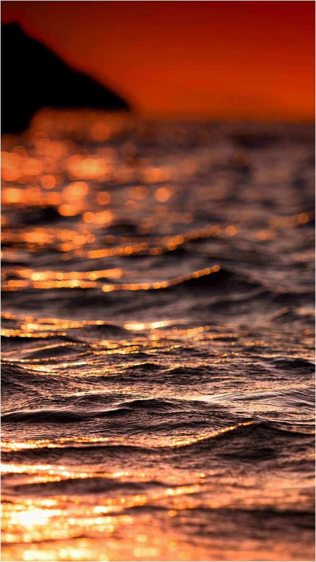 Sunset ocean waves, Silhouetted rocky headland, Golden bokeh reflections Sunset ocean waves, Silhouetted rocky headland, Golden bokeh reflections — 1080×1920 HD wallpaper