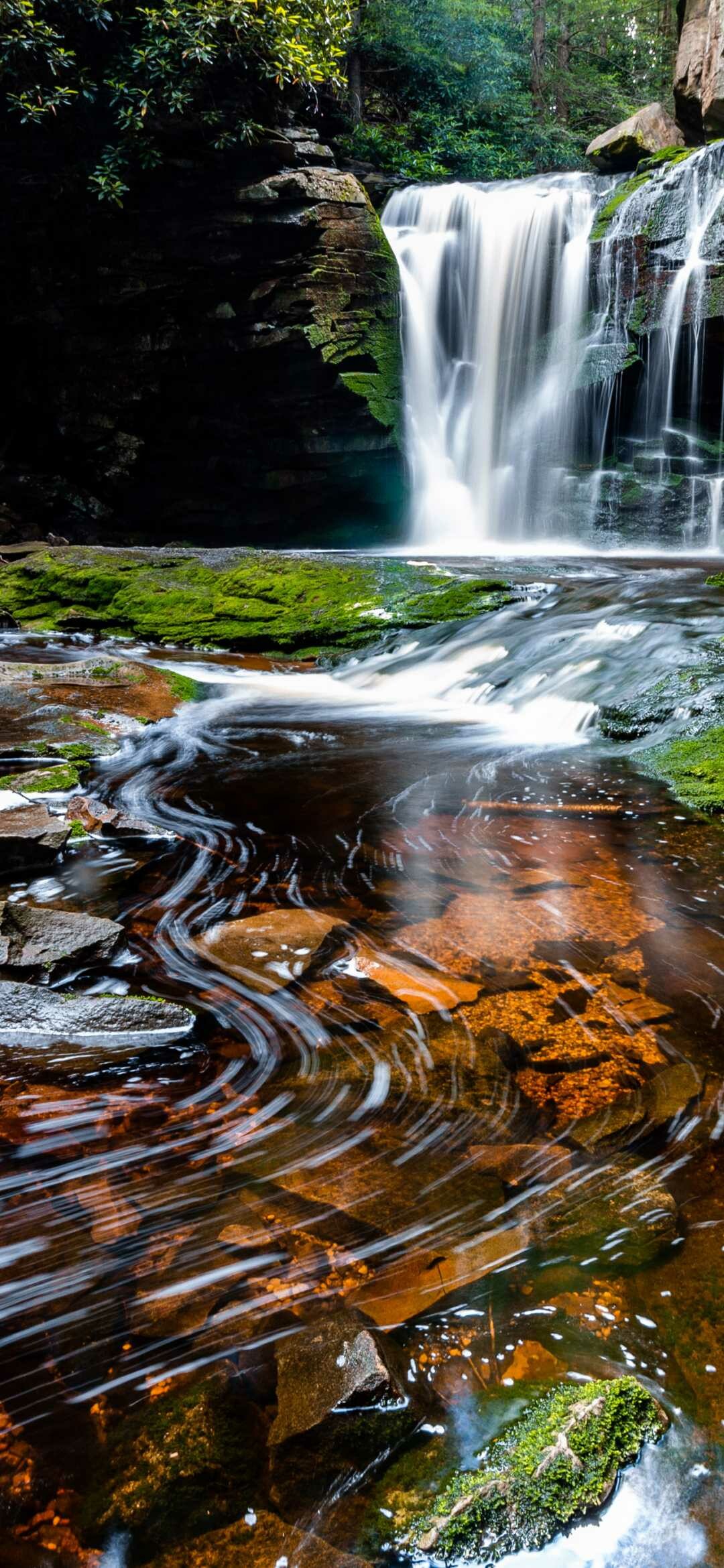 Cascading forest waterfall, Moss-covered rocky pool, Swirling long-exposure water Cascading forest waterfall, Moss-covered rocky pool, Swirling long-exposure water — 1080×2340 HD wallpaper