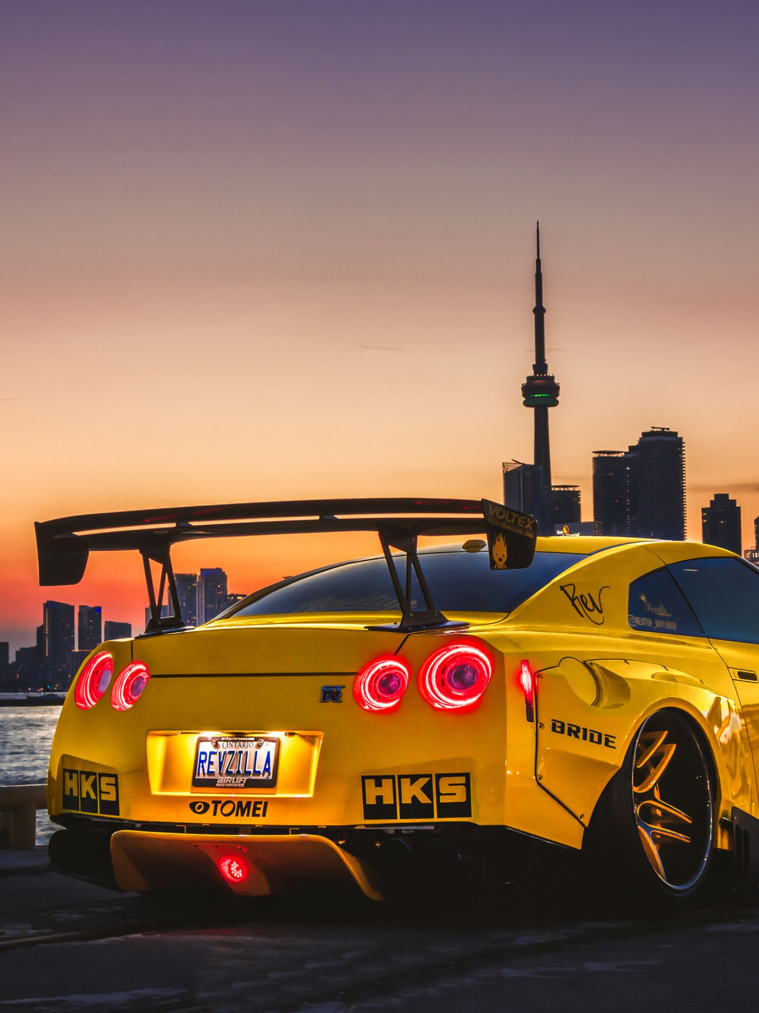 Nissan GT-R R35, Yellow coupe, CN Tower Toronto, REVZILLA HKS TOMEI decals Nissan GT-R R35, Yellow coupe, CN Tower Toronto, REVZILLA HKS TOMEI decals — 1536×2048 HD wallpaper