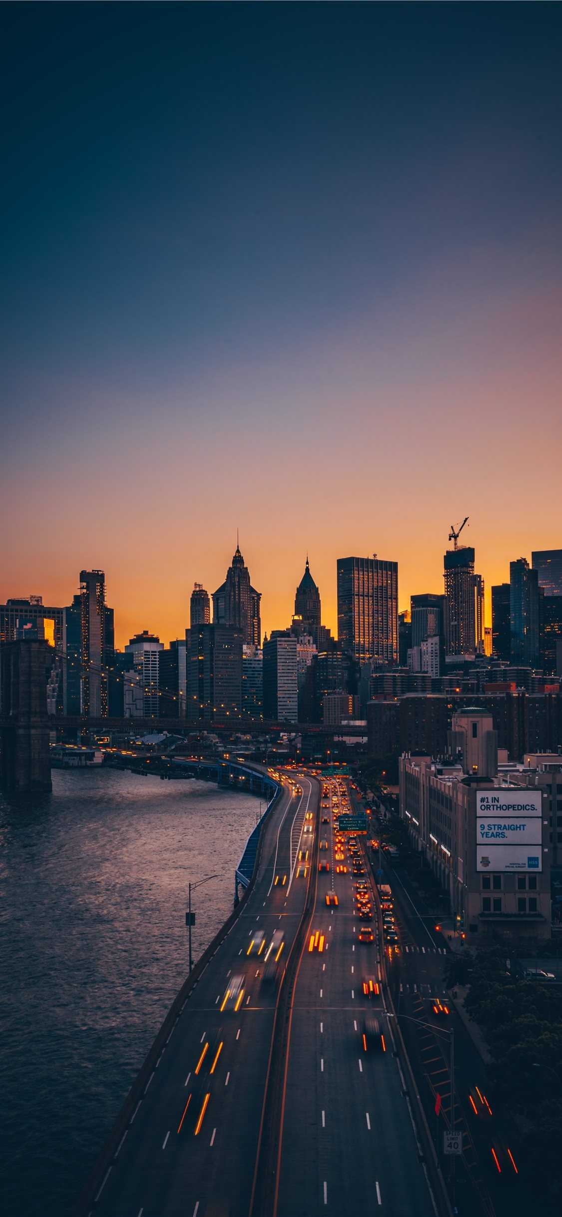 FDR Drive sunset, Manhattan Bridge viewpoint, Brooklyn Bridge, Silhouette skyline, Lower Manhattan, East River FDR Drive sunset, Manhattan Bridge viewpoint, Brooklyn Bridge, Silhouette skyline, Lower Manhattan, East River — 1125×2436 HD wallpaper