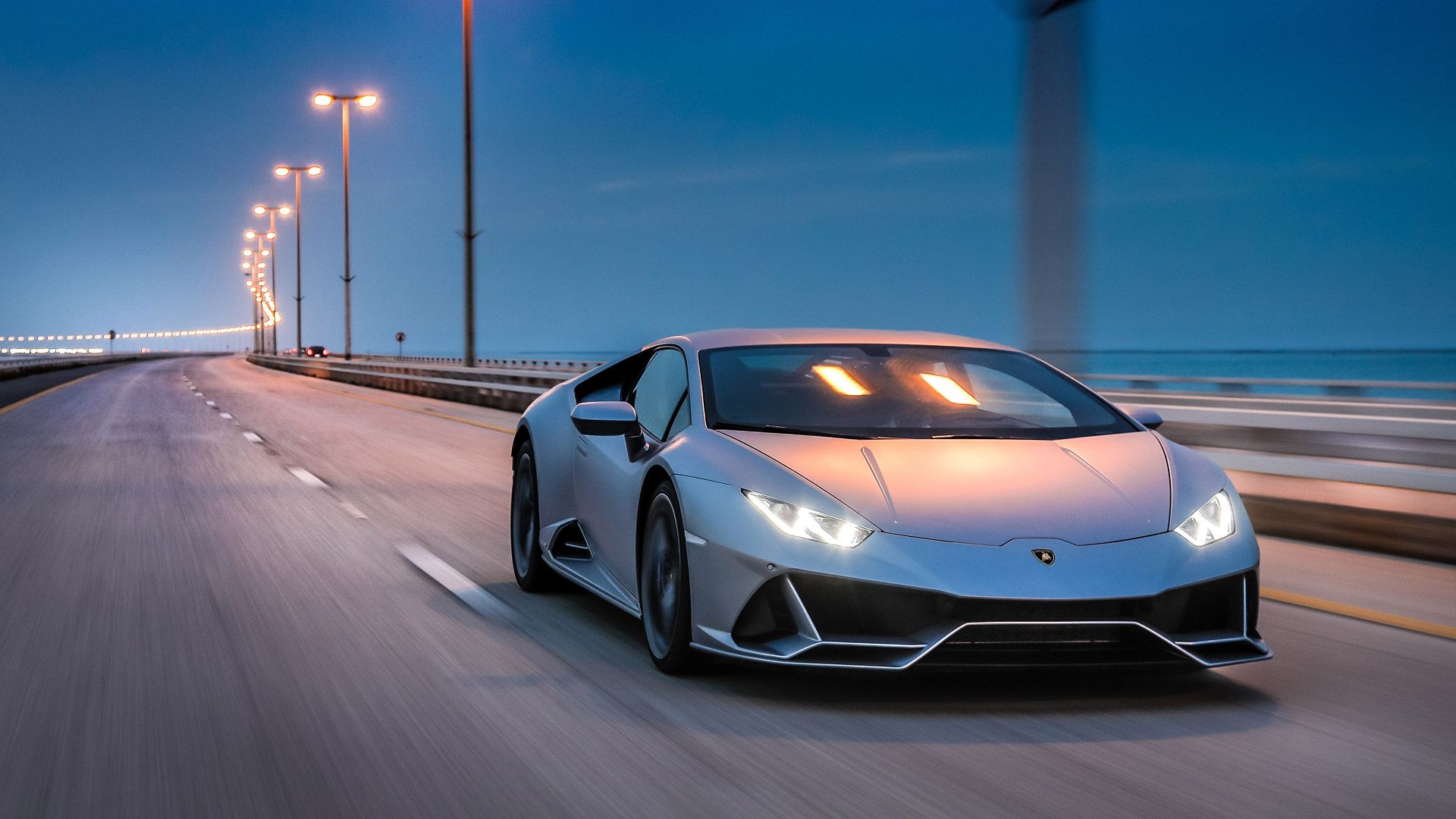Lamborghini Huracan Evo, Coastal bridge highway, Dusk street lights Lamborghini Huracan Evo, Coastal bridge highway, Dusk street lights — 1920×1080 HD wallpaper