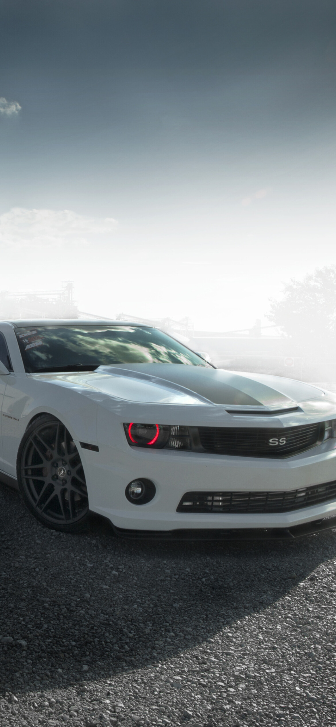 Chevrolet Camaro SS, White muscle car, Hazy gravel lot Chevrolet Camaro SS, White muscle car, Hazy gravel lot — 1170×2532 HD wallpaper
